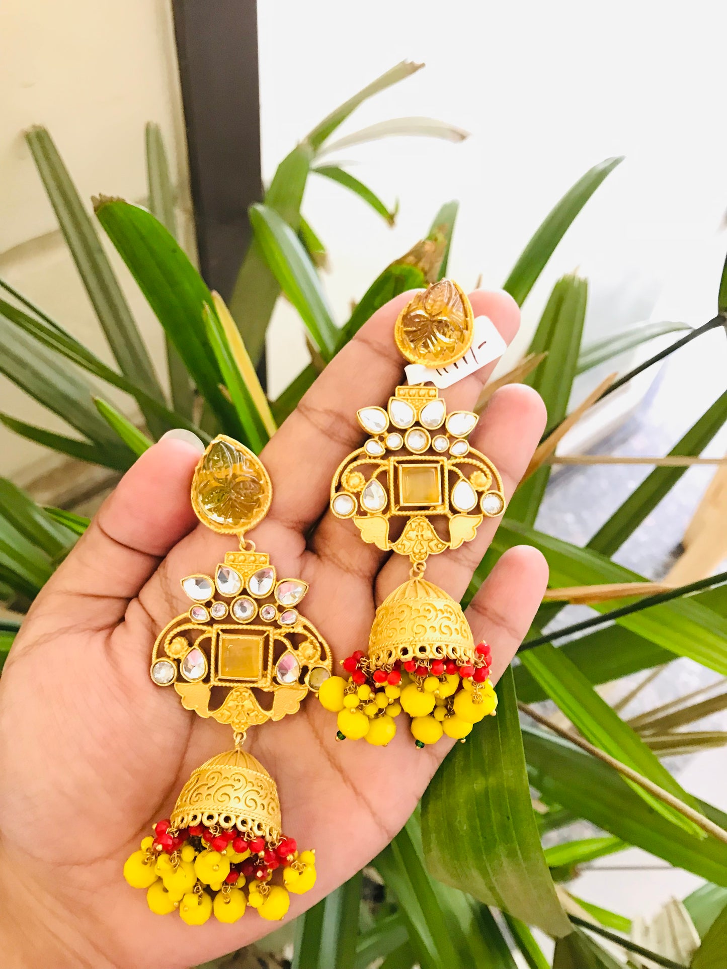 Matte Gold Jhumkas with Natural Carved Stone